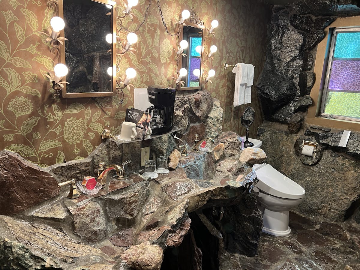 The bathroom in Kona Rock is made ofmrocks too - the sink is a huge uneven piece of rock