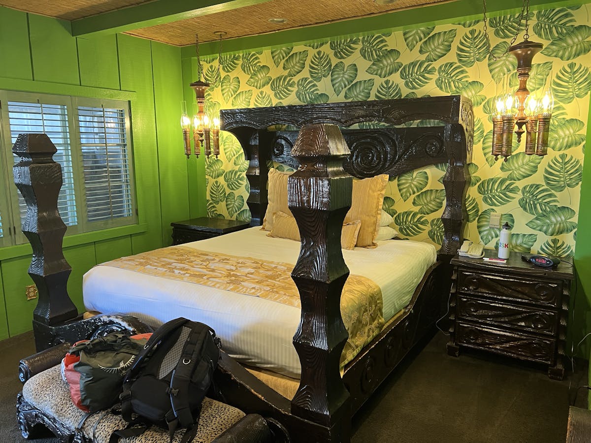 The Safari room has a beautiful four poster bed and exciting wallpaper