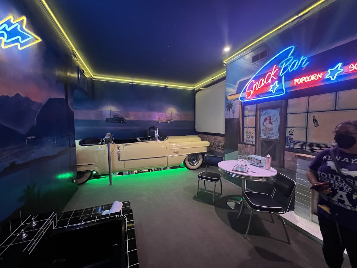 The 1950s suite with neon lights and a car for a bed